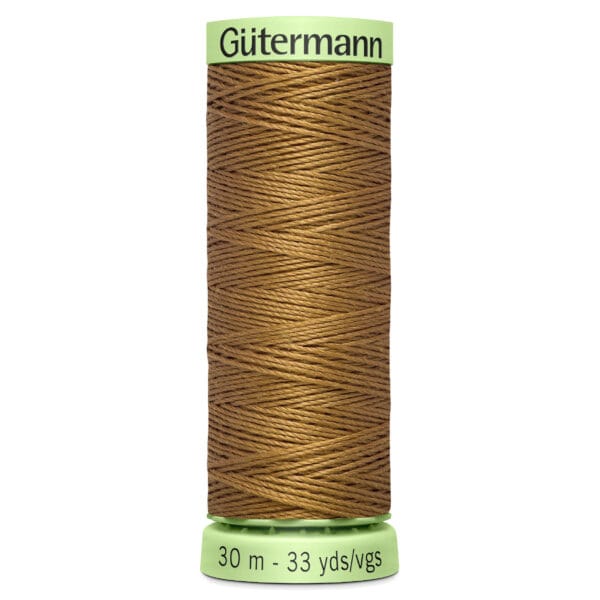 A spool of Gutermann brown thread is vertically positioned against a white background. The spool is labeled with "30 m - 33 yds/vgs" on a green base and the brand name in green on top.