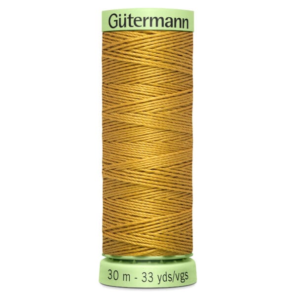 Spool of Gütermann golden yellow thread, labeled 30 meters or 33 yards.