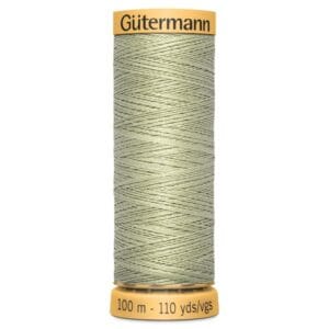 A spool of Gütermann thread with a light green color. The label indicates it contains 100 meters (110 yards) of thread.