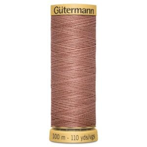 A spool of Gütermann sewing thread in a brownish-pink shade. The label displays "100 m - 110 yds/vgs" indicating the length of the thread.