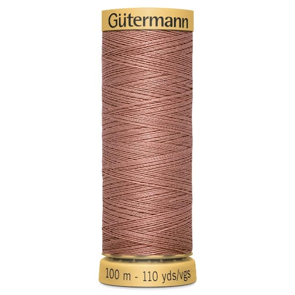 A spool of Gütermann sewing thread in a brownish-pink shade. The label displays "100 m - 110 yds/vgs" indicating the length of the thread.