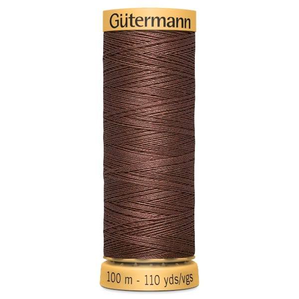 A spool of Gütermann sewing thread in brown, featuring a label on top and bottom. The spool indicates it contains 100 meters or 110 yards of thread.