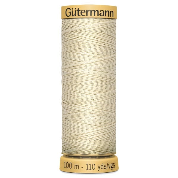 A spool of Gütermann sewing thread, labeled as 100 meters or 110 yards. The thread is light beige, neatly wound, with a yellow cap and base displaying the brand and length information.