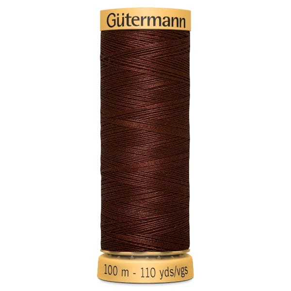 A spool of Gütermann sewing thread in deep brown color. The spool label indicates the length as 100 meters or 110 yards.