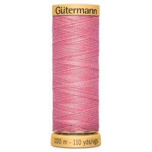 Spool of Güttermann pink sewing thread, labeled with a length of 100 meters (110 yards).