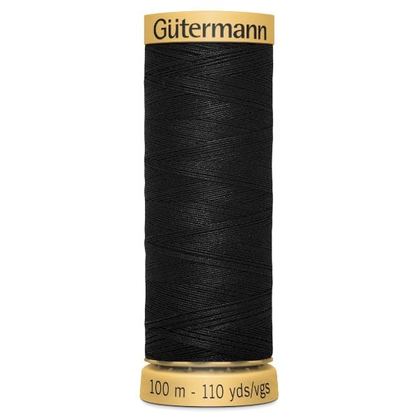 A spool of Gütermann black sewing thread with yellow ends, labeled with "100 m - 110 yds/vgs.