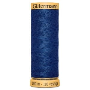 Spool of Gütermann sewing thread in dark blue, labeled with 100 meters and 110 yards.