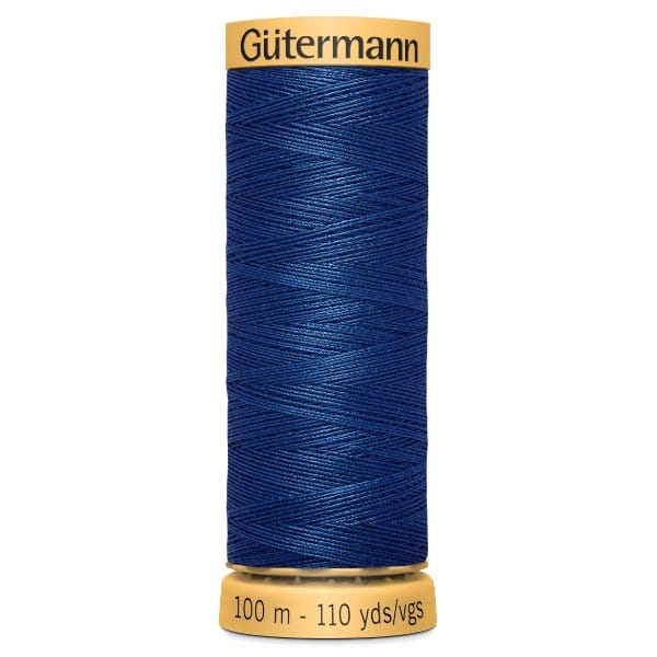 Spool of Gütermann sewing thread in dark blue, labeled with 100 meters and 110 yards.