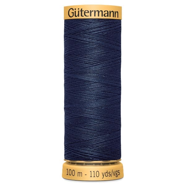 A spool of Gütermann navy blue sewing thread. The spool is labeled with "Gütermann" at the top and "100 m - 110 yds/vgs" at the bottom. The thread is tightly wound with a smooth texture.