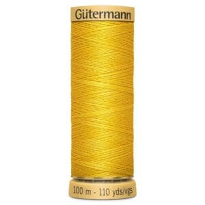 Spool of Gütermann sewing thread in bright yellow. The label reads "100 m - 110 yds/vgs." The thread is wound neatly around the spool.