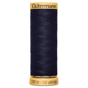 A spool of Gütermann black thread, labeled with "100 m - 110 yds" on the bottom.