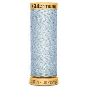 A spool of Gütermann sewing thread in light blue. The spool is labeled with "Gütermann" at the top and "100 m - 110 yds" at the bottom.