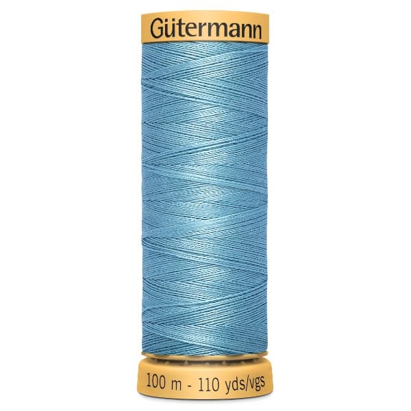 Spool of Gütermann sewing thread in light blue, with two yellow ends. The label indicates 100 meters (110 yards).