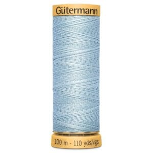 A spool of Gütermann thread, featuring light blue polyester sewing thread. The spool displays the brand name at the top and indicates a length of 100 meters or 110 yards at the bottom.