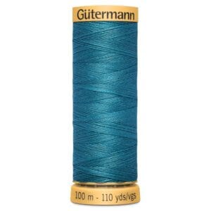 A spool of Gütermann sewing thread in teal, showing intricate winding pattern. The label on top reads "Gütermann" and the base indicates "100 m - 110 yds/vgs.