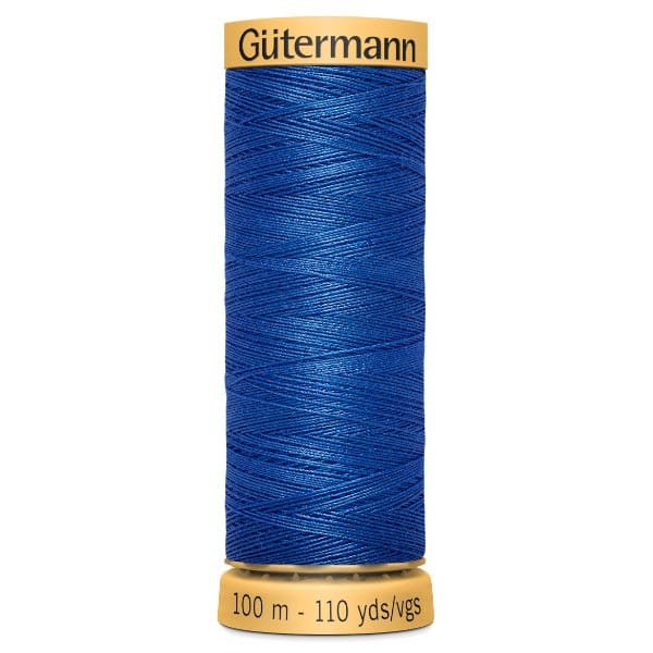 A spool of Gütermann thread in vibrant royal blue color, labeled with a length of 100 meters or 110 yards. The spool has a yellow cap and base.