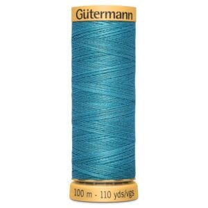 Spool of Gütermann thread in teal blue, labeled 100 meters, 110 yards. The spool has yellow ends with the Gütermann brand name on top.