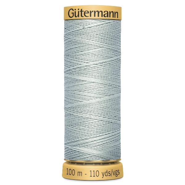 Spool of Gütermann sewing thread, light blue in color, wound neatly on a yellow spool labeled with "100 m - 110 yds/vgs.