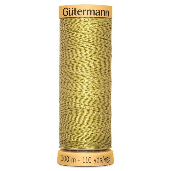 A spool of Gütermann thread in gold, labeled with "Gütermann" on top and "100 m - 110 yds/vgs" at the bottom. The thread is neatly wound, showcasing a crosshatch pattern.