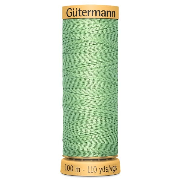 A spool of Gütermann sewing thread in mint green. The spool's label indicates it contains 100 meters or 110 yards of thread.