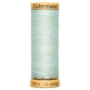 A spool of Gütermann sewing thread, light green in color, with a yellow cap and base. The spool is labeled with thread length of 100 meters or 110 yards.