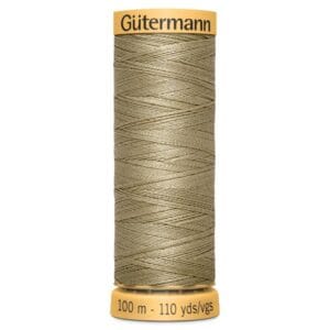 A spool of Gütermann sewing thread in a light olive color, labeled with a length of 100 meters and 110 yards. The top and bottom of the spool are mustard yellow with the brand name at the top.