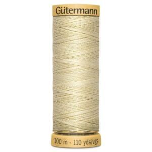A spool of Gütermann sewing thread in a pale cream color. The spool is labeled with "Gütermann" at the top and indicates that it contains 100 meters or 110 yards of thread.