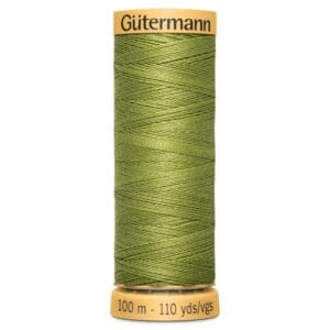 A spool of Gütermann sewing thread, olive green in color. The spool has a yellow top and base, labeled with "Gütermann" on the top and "100 m - 110 yds/vgs" on the bottom.
