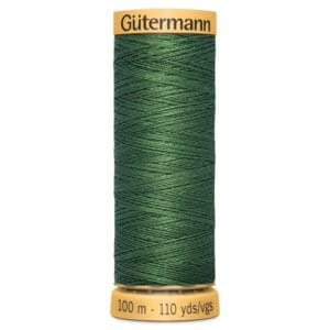 A spool of Gütermann thread in dark green is displayed upright. The label shows the thread length as 100 meters or 110 yards.