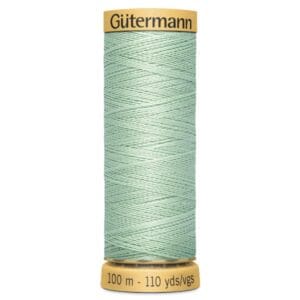 A spool of Gütermann sewing thread with a light green color. The spool label indicates it contains 100 meters or 110 yards of thread.