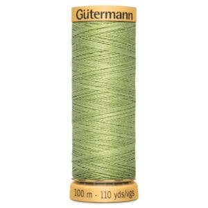 A spool of Gütermann thread in light green, labeled with "100 m - 110 yds/vgs" on a yellow base.