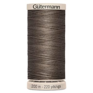 A spool of Gütermann thread in a dark brown color. The label indicates it contains 200 meters (220 yards) of thread. The spool is cylindrical with a beige cap and base.