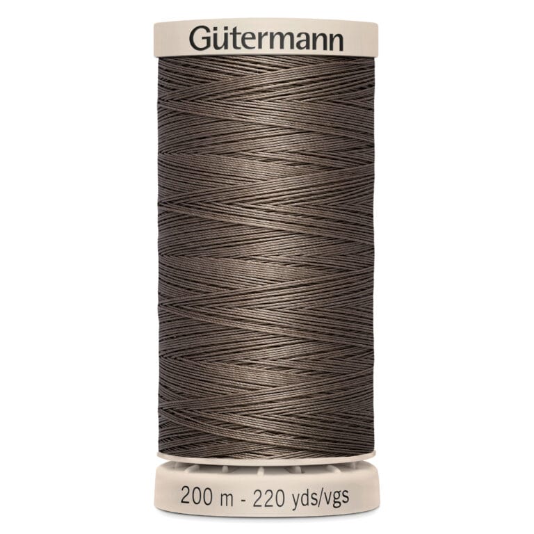 A spool of Gütermann thread in a dark brown color. The label indicates it contains 200 meters (220 yards) of thread. The spool is cylindrical with a beige cap and base.