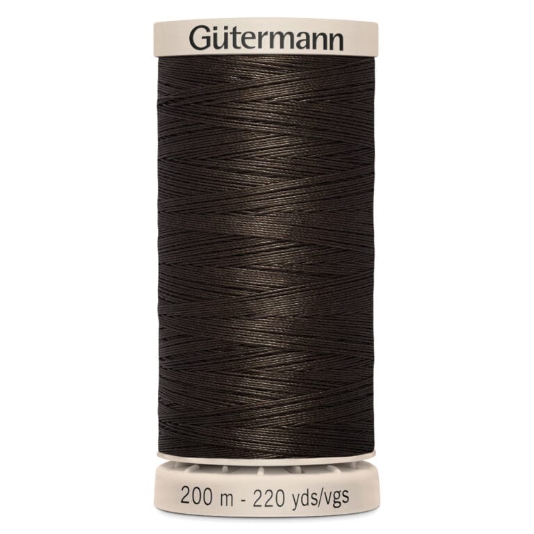 A spool of Gütermann black sewing thread, labeled for 200 meters or 220 yards. The thread is tightly wound around a white spool with labeling on top and bottom.