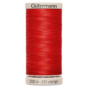 A spool of Gütermann thread in bright red color. The label indicates it is 200 meters or 220 yards long.