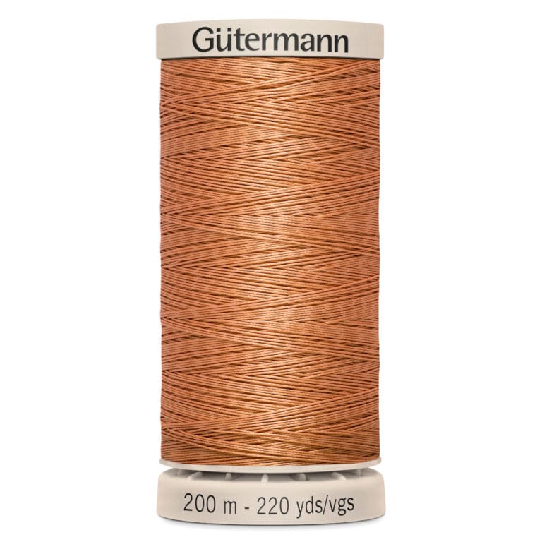 A spool of Gütermann sewing thread in a rich copper color, labeled with 200 meters or 220 yards. The spool has a cream-colored top and bottom.