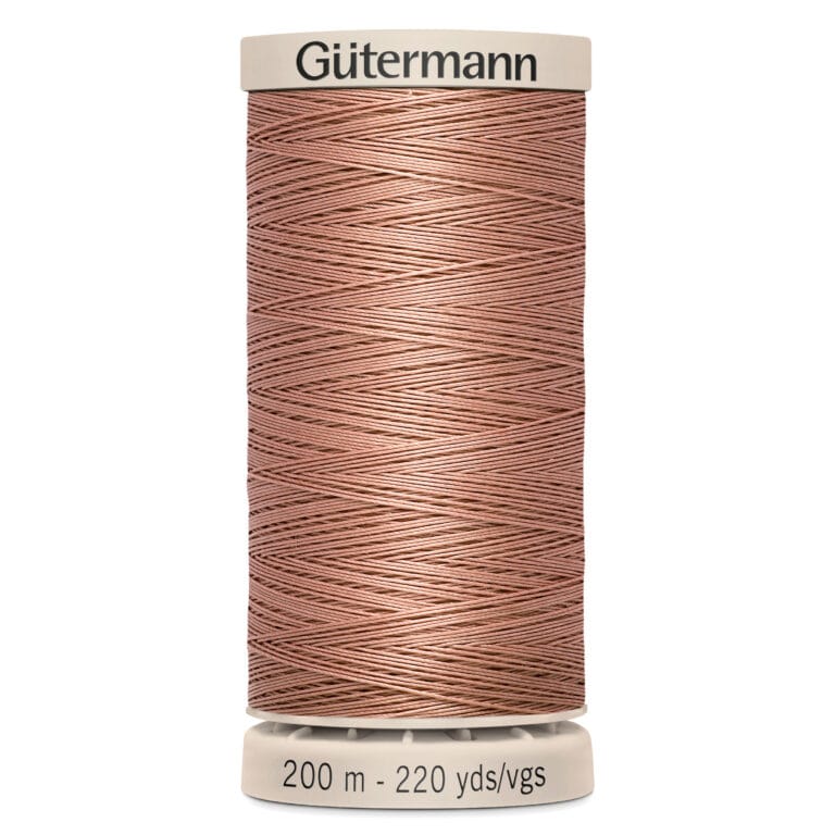 A spool of Gütermann sewing thread with a tan color. The top and bottom are labeled, indicating 200 meters and 220 yards of thread.