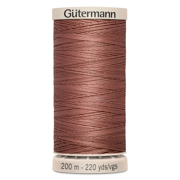 A spool of Gütermann sewing thread in a shade of brown is displayed. The spool includes labels indicating the length as 200 meters or 220 yards.