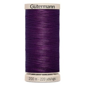 A spool of purple Gütermann thread with a beige top and bottom. The thread length is marked as 200 meters or 220 yards.