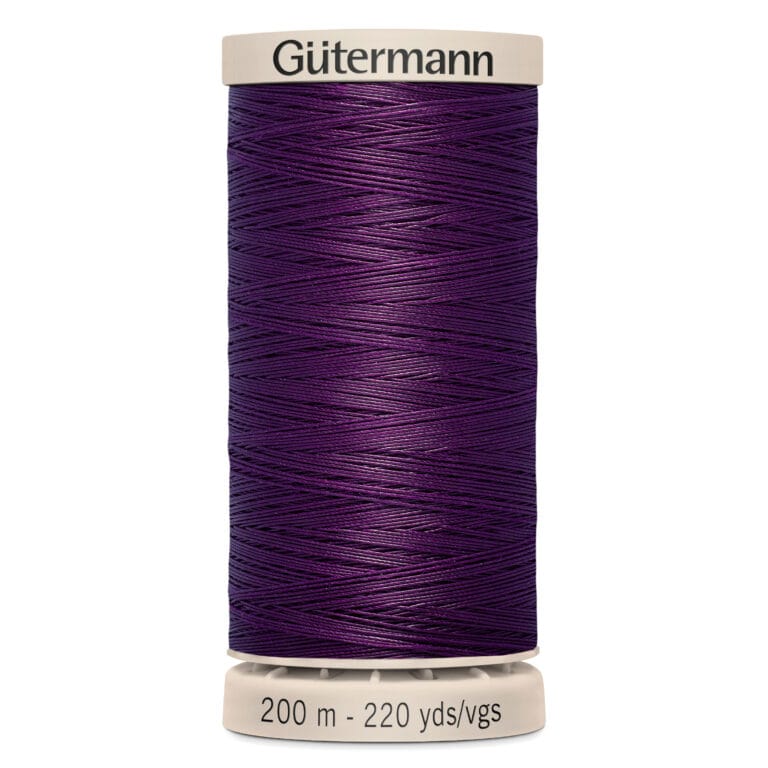 A spool of purple Gütermann thread with a beige top and bottom. The thread length is marked as 200 meters or 220 yards.