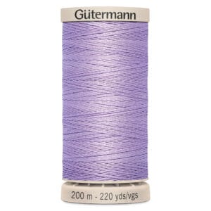 A spool of Gütermann sewing thread in a lavender color. The spool displays the brand name "Gütermann" on top and indicates a length of 200 meters or 220 yards.