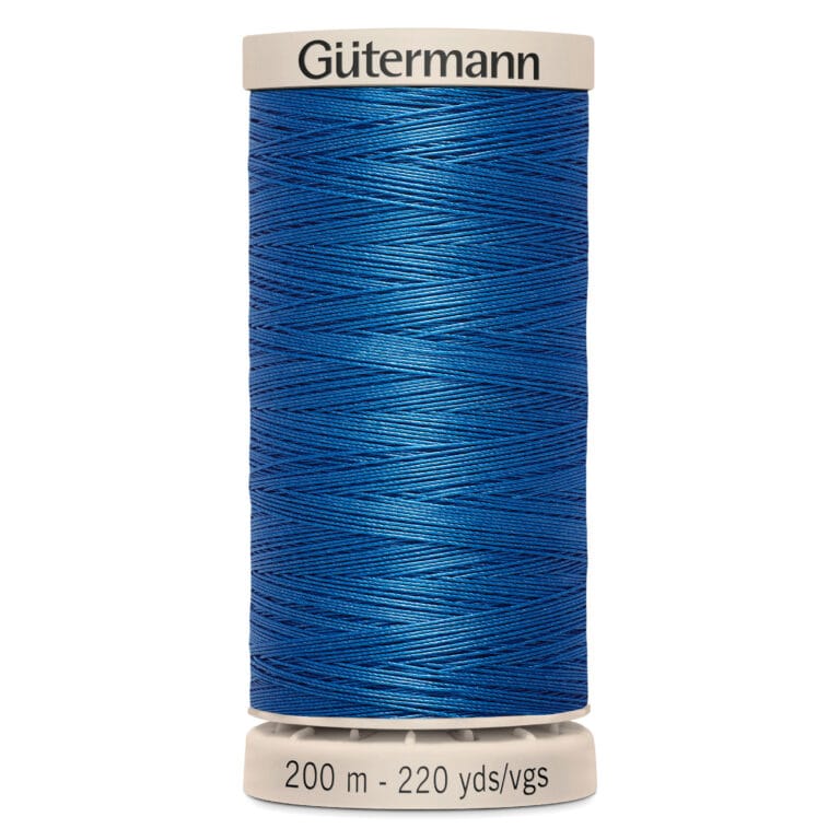 A spool of Gütermann blue thread, labeled for 200 meters or 220 yards of length.