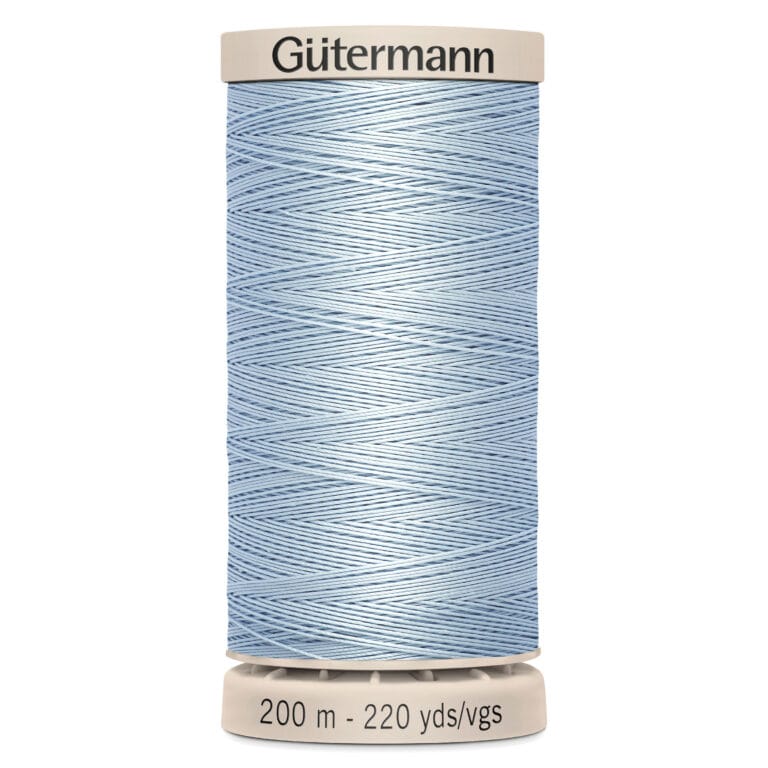 A spool of light blue Gütermann sewing thread, labeled with a length of 200 meters or 220 yards. The spool is white with coordinating cap and base.