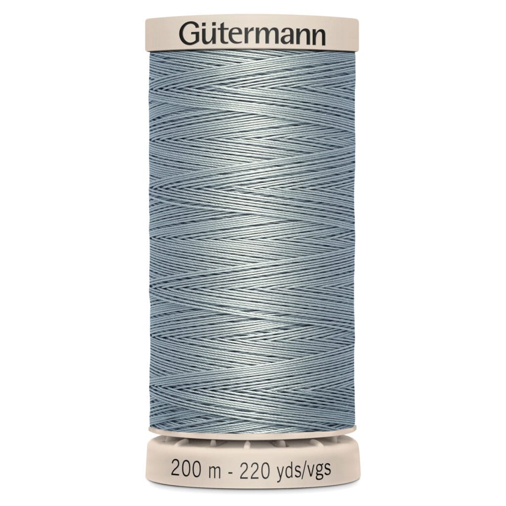 A spool of Gütermann sewing thread, pale blue in color, labeled with a length of 200 meters or 220 yards. The spool is set against a plain white background.