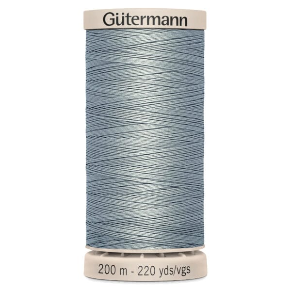 A spool of Gütermann sewing thread, pale blue in color, labeled with a length of 200 meters or 220 yards. The spool is set against a plain white background.