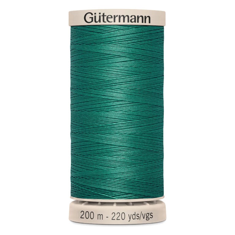 A spool of green Gütermann sewing thread, labeled with "200 m - 220 yds/vgs" on the base. The thread is neatly wound around the spool.