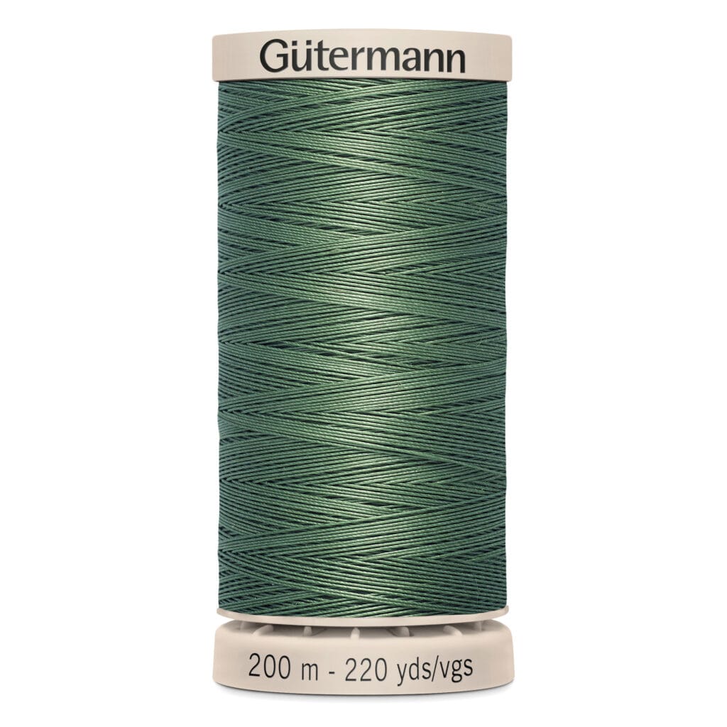 A spool of Gütermann green sewing thread is displayed upright. The label shows "200 m - 220 yds/vgs" on the bottom and "Gütermann" on the top. The thread is tightly wound with a smooth texture.