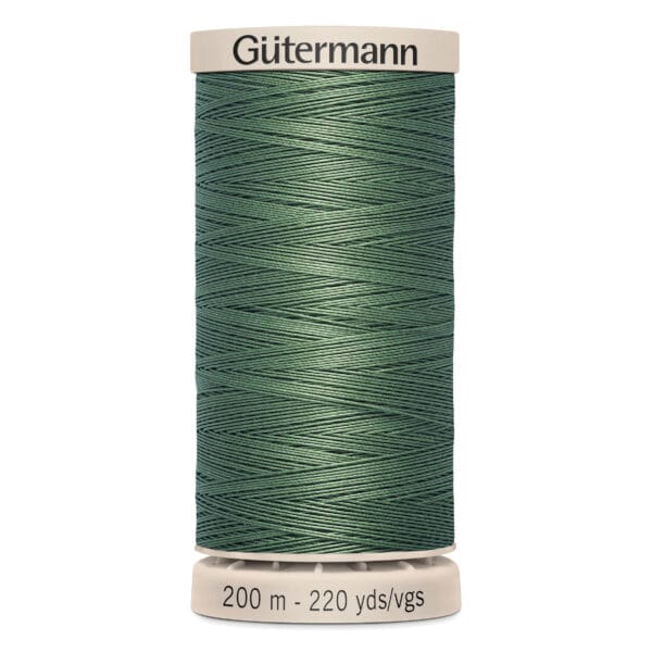 A spool of Gütermann green sewing thread is displayed upright. The label shows "200 m - 220 yds/vgs" on the bottom and "Gütermann" on the top. The thread is tightly wound with a smooth texture.