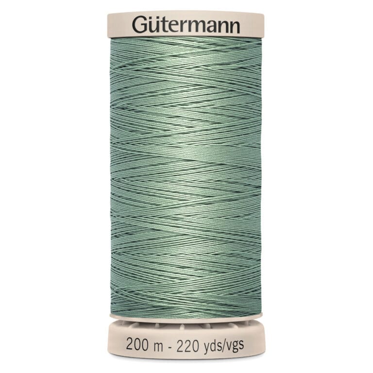 A spool of Gütermann sewing thread in a light green color. The label at the top displays the brand name. The base label indicates the length of the thread as 200 meters or 220 yards.