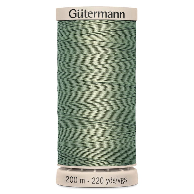 A spool of Gütermann sewing thread, light sage green in color. The top reads "Gütermann," and the bottom indicates 200 meters or 220 yards of thread. The spool has ridged ends for holding the thread.